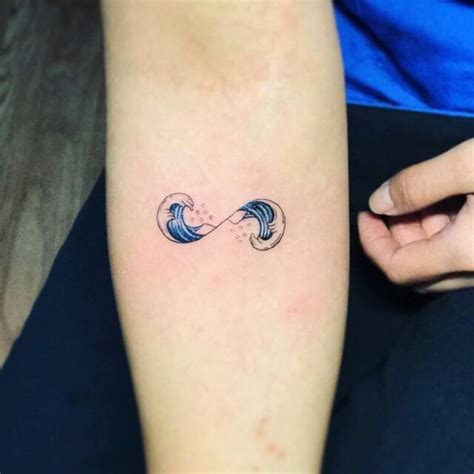 moon and wave tattoo|tiny waves all black design.